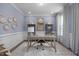 Stylish home office with light blue walls, a spacious desk, and ample natural light at 31 Priming Way, Angier, NC 27501