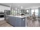 This open-concept kitchen provides stainless appliances and a clear view into the dining and living spaces at 31 Priming Way, Angier, NC 27501