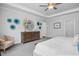 This main bedroom is decorated with soft colors, a ceiling fan, and crown molding at 31 Priming Way, Angier, NC 27501