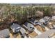 An aerial view reveals a neighborhood with lush trees, manicured lawns, and well-maintained homes at 312 Homestead Park Dr, Apex, NC 27502