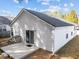 Exterior features light siding, dark roof, a walkout deck, and sliding glass doors to the backyard at 312 Homestead Park Dr, Apex, NC 27502