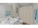 Bright bathroom featuring a vanity with sink, toilet, shower with curtain, and modern fixtures at 312 Homestead Park Dr, Apex, NC 27502