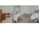 This charming bedroom features a comfortable bed, a desk, and convenient access to the bathroom and closet at 312 Homestead Park Dr, Apex, NC 27502