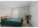 Simple bedroom featuring a bed, double closet, and natural light from the window at 312 Homestead Park Dr, Apex, NC 27502