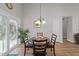 Bright dining area with a round table, four chairs, and a sliding glass door to the outside at 312 Homestead Park Dr, Apex, NC 27502