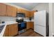 Well-equipped kitchen with oak cabinets, stainless appliances, and tile backsplash at 312 Homestead Park Dr, Apex, NC 27502