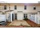 Back exterior showcasing patio, and a neatly fenced yard with mature trees at 3122 Coxindale Dr, Raleigh, NC 27615