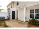 Backyard patio area, perfect for entertaining, with a black door and AC unit at 3122 Coxindale Dr, Raleigh, NC 27615
