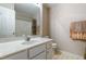 Well-lit bathroom featuring a vanity with a large mirror and a shower-tub combo at 3122 Coxindale Dr, Raleigh, NC 27615