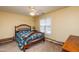 Bedroom with yellow walls, ceiling fan and natural light at 3122 Coxindale Dr, Raleigh, NC 27615