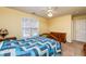 Bedroom with yellow walls, carpet, and ceiling fan at 3122 Coxindale Dr, Raleigh, NC 27615