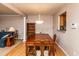 Dining area with wood floors adjacent to kitchen and living room, offering an open and inviting space at 3122 Coxindale Dr, Raleigh, NC 27615
