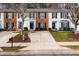 Charming townhomes with well-maintained lawns, mature trees, and updated exterior finishes at 3122 Coxindale Dr, Raleigh, NC 27615
