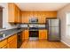This efficient kitchen has stainless steel appliances, stone countertops, and wooden cabinetry at 3122 Coxindale Dr, Raleigh, NC 27615