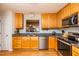 A functional kitchen features stainless steel appliances, stone countertops and wooden cabinets at 3122 Coxindale Dr, Raleigh, NC 27615