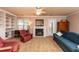 Inviting living room with a fireplace, built-in shelving, and comfortable seating offers relaxation at 3122 Coxindale Dr, Raleigh, NC 27615