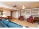 Open-concept living area connecting to a dining room featuring a ceiling fan and comfortable seating at 3122 Coxindale Dr, Raleigh, NC 27615