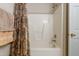 Clean shower area with a floral-patterned shower curtain at 3122 Coxindale Dr, Raleigh, NC 27615