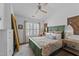 Cozy bedroom featuring a bed, a window for natural light, and a colorful decorative style at 3124 Elm Tree Ln, Raleigh, NC 27614