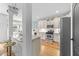 A modern kitchen featuring white countertops, stainless steel appliances, and a breakfast bar at 3124 Elm Tree Ln, Raleigh, NC 27614