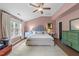 Bright main bedroom with vaulted ceiling, a large window and neutral color palette at 3124 Elm Tree Ln, Raleigh, NC 27614