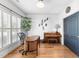Bright office space with hardwood floors, plantation shutters, and a decorative accent wall at 3124 Elm Tree Ln, Raleigh, NC 27614