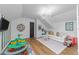 Bright playroom with a chandelier, white sofa, and colorful toys, perfect for  at 3124 Elm Tree Ln, Raleigh, NC 27614