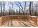 Wooden deck overlooking wooded backyard, perfect for outdoor relaxation and entertainment at 325 Bainbridge Cir, Garner, NC 27529