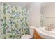 Bathroom featuring a vibrant, botanical-themed shower curtain and classic fixtures at 325 Bainbridge Cir, Garner, NC 27529