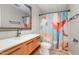 Modern bathroom with stylish vanity, colorful shower curtain, and sleek fixtures at 325 Bainbridge Cir, Garner, NC 27529