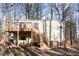 Exterior view of the home showcasing the deck and backyard at 325 Bainbridge Cir, Garner, NC 27529