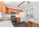 Functional kitchen with stainless steel appliances, wood cabinets and plenty of counter space at 325 Bainbridge Cir, Garner, NC 27529