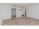The living room is freshly painted with wood-look floors and ample lighting at 325 Bainbridge Cir, Garner, NC 27529