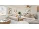 Bright and airy living room featuring modern decor, stylish furnishings, and a dining area at 325 Bainbridge Cir, Garner, NC 27529