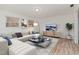 Cozy living room with a sectional sofa, stylish coffee table, and bright natural light at 325 Bainbridge Cir, Garner, NC 27529