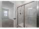 Bathroom showing a glass-enclosed shower, and neutral color palette at 3424 Writt Ct, New Hill, NC 27562