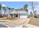 Charming single-Gathering home with a mix of siding, stone accents, and a two-car garage at 3424 Writt Ct, New Hill, NC 27562