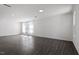 Spacious living room featuring hardwood floors and ample natural light from large windows at 3424 Writt Ct, New Hill, NC 27562