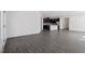 Open floor plan view of the living room with a modern kitchen and dining area at 3424 Writt Ct, New Hill, NC 27562