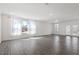 Bright and airy living room with ample natural light and hardwood floors at 3424 Writt Ct, New Hill, NC 27562