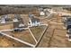 Aerial view of a home with a spacious backyard featuring white fencing, offering privacy and room to roam at 350 Arlie Ln, Lillington, NC 27546
