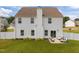 The backyard has green grass, white siding, and an outdoor seating area at 350 Arlie Ln, Lillington, NC 27546