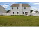 This backyard features a green lawn, privacy fence, and patio seating at 350 Arlie Ln, Lillington, NC 27546