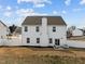 Spacious backyard with pristine white fencing and charming patio area, ideal for entertaining outdoors at 350 Arlie Ln, Lillington, NC 27546