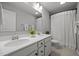 Elegant bathroom featuring dual sinks, white cabinets and shower curtain at 350 Arlie Ln, Lillington, NC 27546