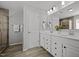 This bathroom features double sinks, cabinets, and a glass enclosed shower at 350 Arlie Ln, Lillington, NC 27546