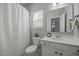 Well-lit bathroom with white vanity, toilet, shower with curtain, and neutral decor at 350 Arlie Ln, Lillington, NC 27546