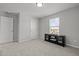 Bedroom featuring a large window, closet, and a black TV stand at 350 Arlie Ln, Lillington, NC 27546