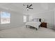 Spacious carpeted bedroom with ceiling fan, bedside tables and natural light at 350 Arlie Ln, Lillington, NC 27546