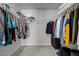 Walk-in closet with an abundance of hanging storage space and carpeted floor at 350 Arlie Ln, Lillington, NC 27546